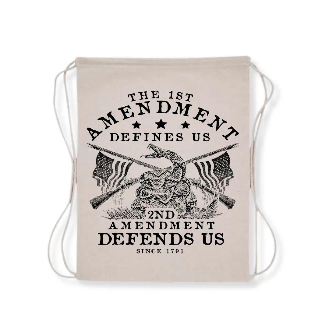 The 1st Amendment Defines Us. The 2nd Amendment Defends Us Drawstring Bag (3 Colors)